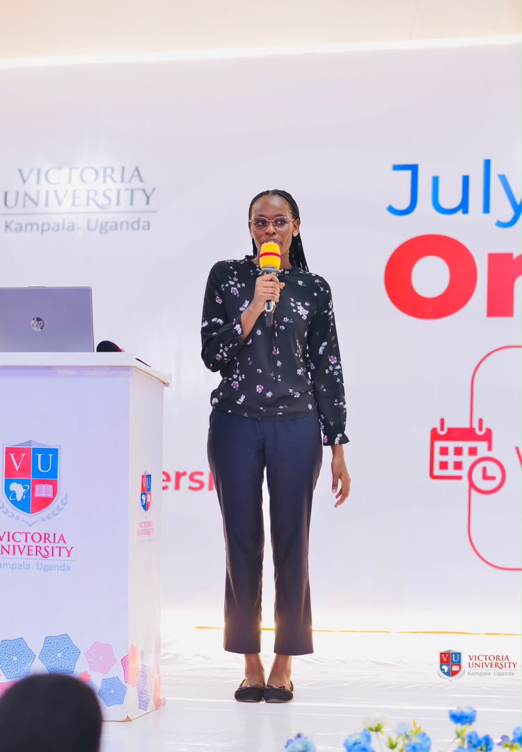Presenter speaking at the podium during a Victoria University intake orientation