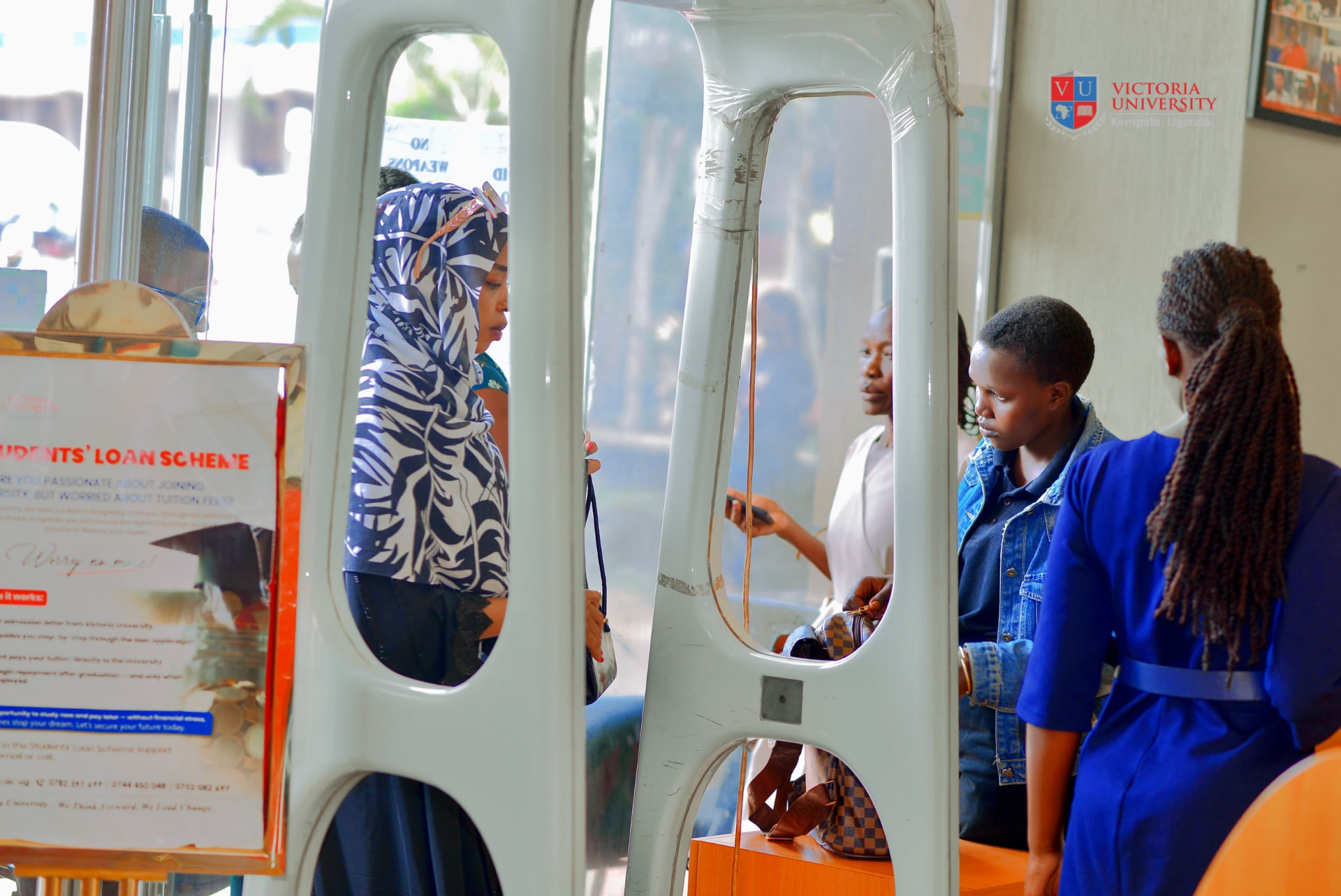 Students at the Victoria University campus entrance beside the students loan scheme desk