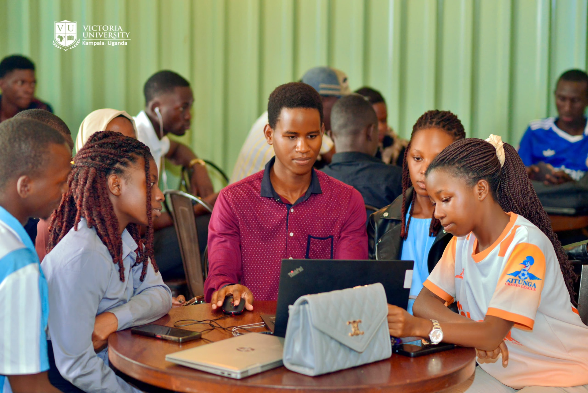Victoria University students in a group study session in the computer lab